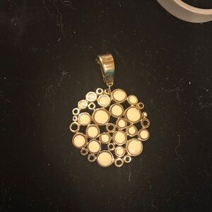 Elegant Gold Pendant with Cream Accents